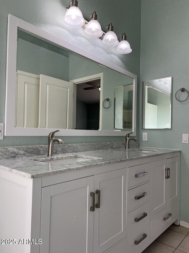 3876 Camino Del Vara, Sierra Vista, AZ 85650 - full bathroom with tile patterned floors, double vanity, and a ceiling fan