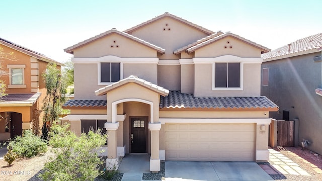 mediterranean / spanish-style home featuring a garage