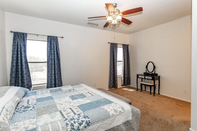 bedroom with light colored carpet and ceiling fan