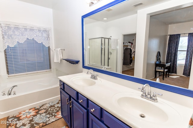 bathroom featuring shower with separate bathtub, tile floors, and dual bowl vanity