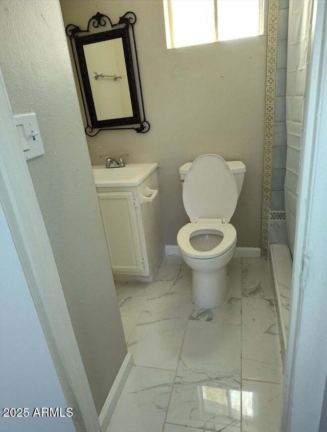 755 E Millett Ave, Mesa, AZ 85204 - bathroom featuring vanity, toilet, baseboards, and marble finish floors