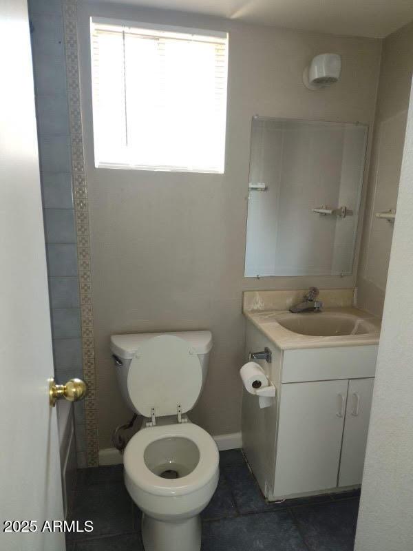 755 E Millett Ave, Mesa, AZ 85204 - bathroom with vanity, toilet, baseboards, and tile patterned floors