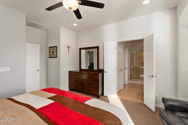 bedroom featuring connected bathroom, ceiling fan, and light tile patterned flooring