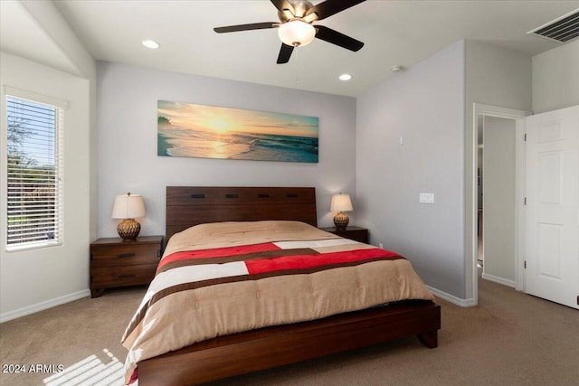 bedroom with light colored carpet and ceiling fan