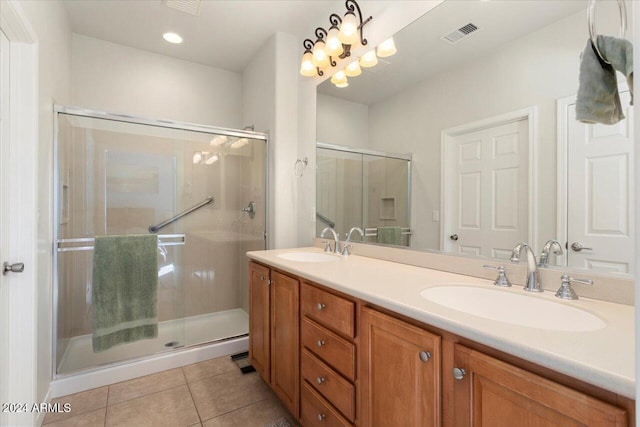 bathroom with vanity, tile patterned floors, and walk in shower