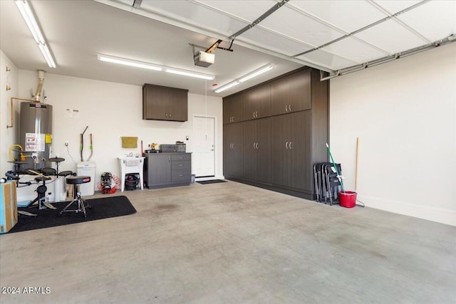 garage featuring gas water heater and a garage door opener