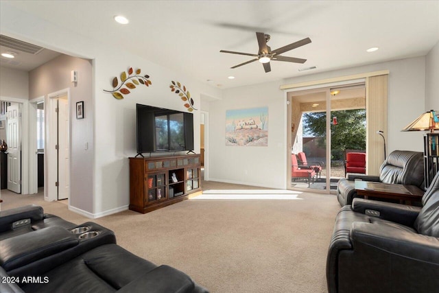 living room featuring ceiling fan and light colored carpet