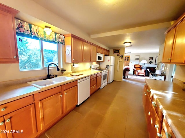 kitchen with white appliances and sink