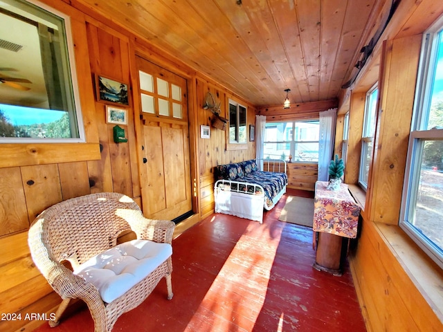 sunroom / solarium featuring wood ceiling