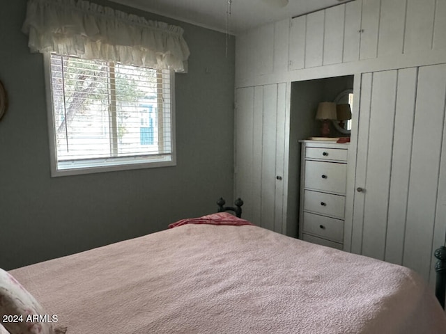 bedroom with wood walls