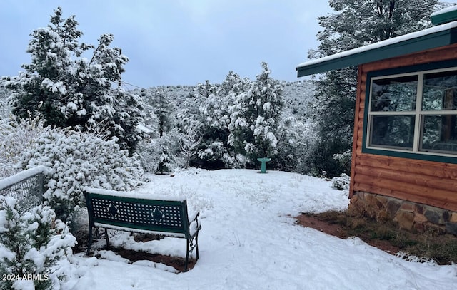 snowy yard with a mountain view