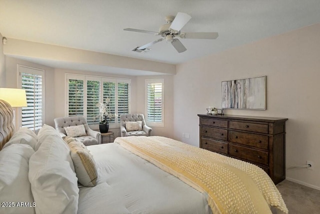 bedroom featuring ceiling fan and carpet