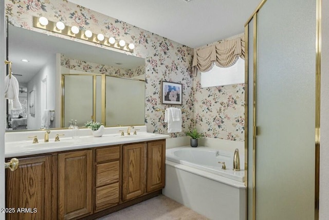 bathroom with vanity and independent shower and bath