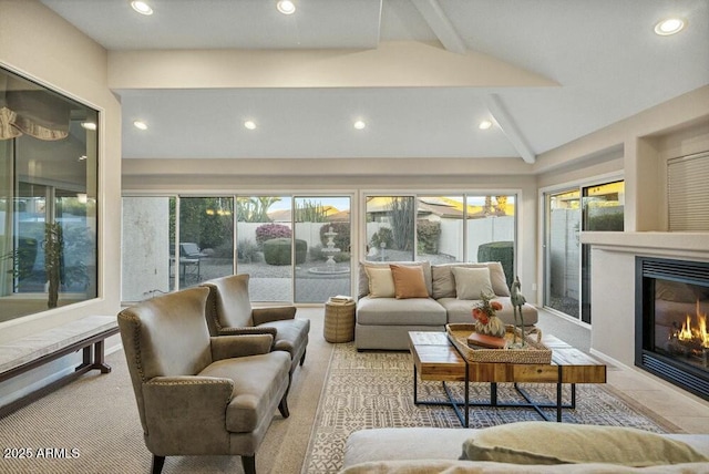 sunroom / solarium featuring lofted ceiling with beams