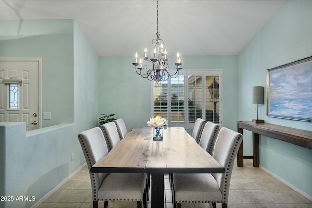 tiled dining space with a chandelier