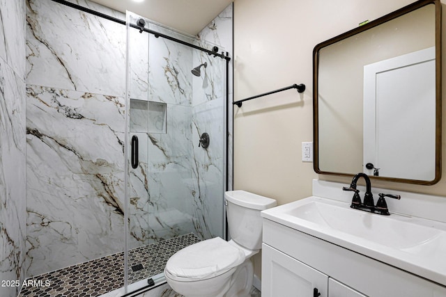 full bath featuring toilet, a marble finish shower, and vanity