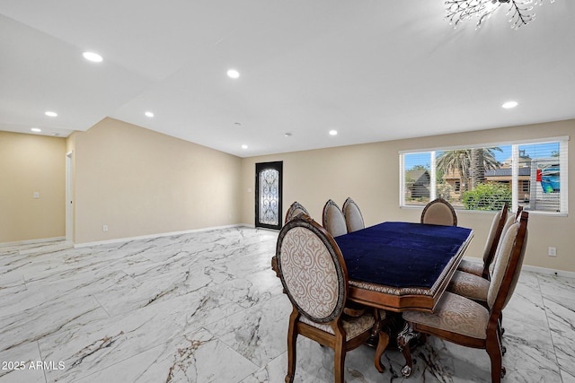 dining area featuring baseboards, recessed lighting, and marble finish floor