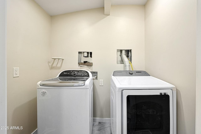 washroom with washer and dryer, laundry area, marble finish floor, and baseboards
