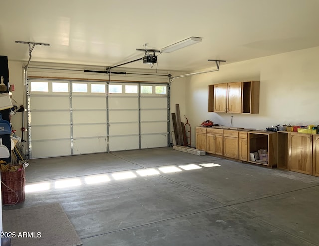 garage featuring a garage door opener