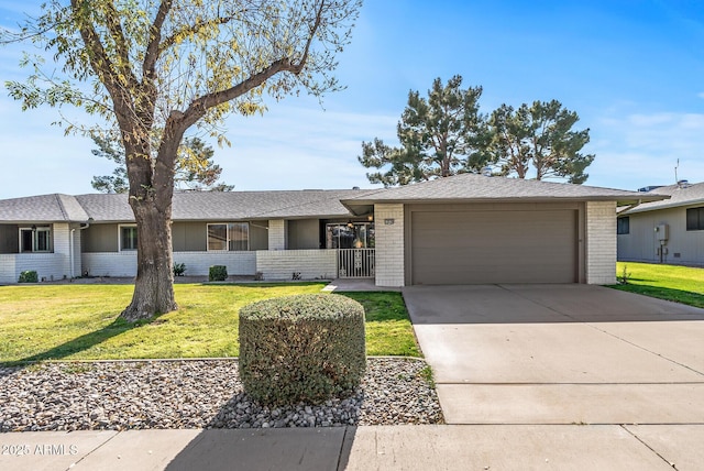 ranch-style home with a front lawn and a garage