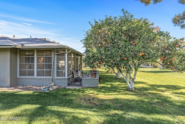 view of yard featuring a sunroom