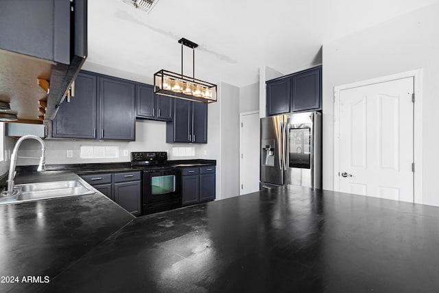 kitchen with pendant lighting, sink, electric range, and stainless steel fridge