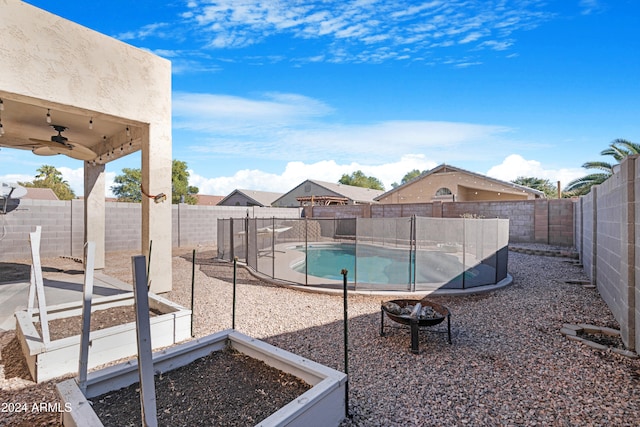 view of swimming pool with ceiling fan