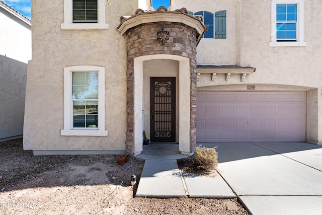 property entrance with a garage