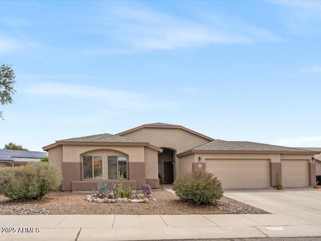 ranch-style home with stucco siding, driveway, and a garage