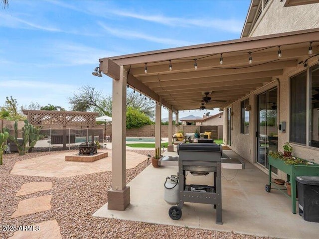 view of patio / terrace with a fenced backyard and ceiling fan