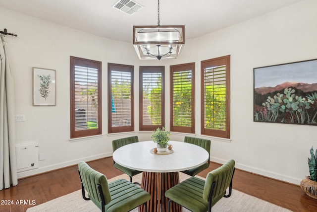 dining area with dark hardwood / wood-style floors