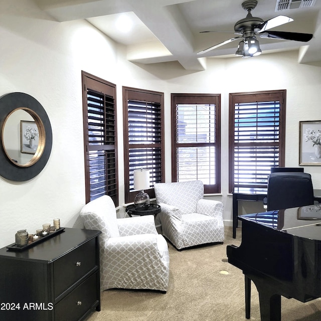 living area with ceiling fan and light colored carpet