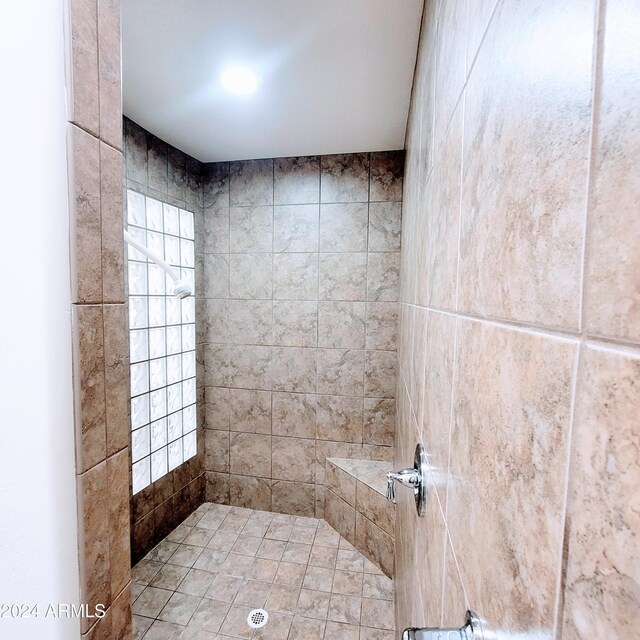 bathroom with a tile shower