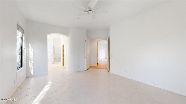 unfurnished room featuring ceiling fan and light tile patterned flooring