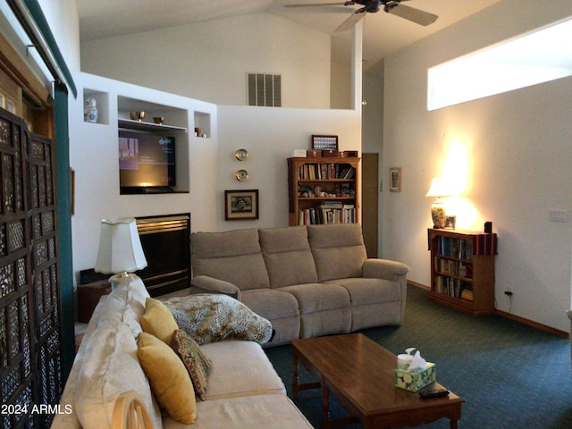 living room with a fireplace, high vaulted ceiling, ceiling fan, and carpet