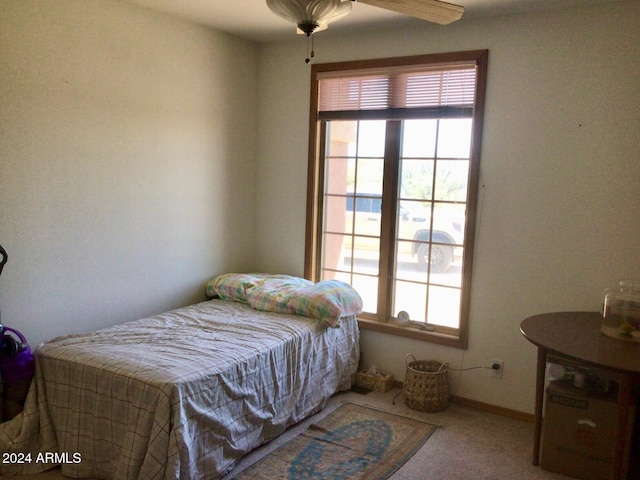 bedroom with ceiling fan and carpet