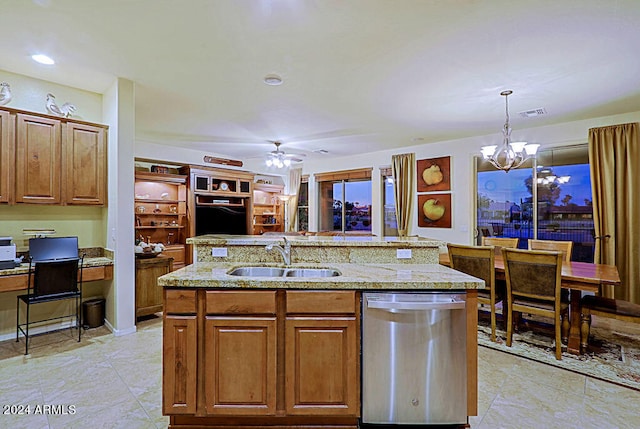 kitchen with dishwasher, an island with sink, sink, pendant lighting, and ceiling fan with notable chandelier