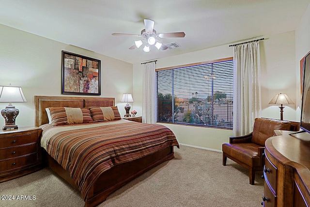 carpeted bedroom with ceiling fan