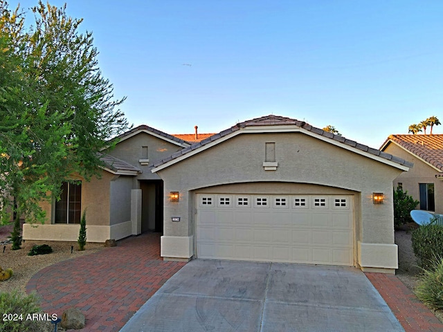 view of front of home with a garage