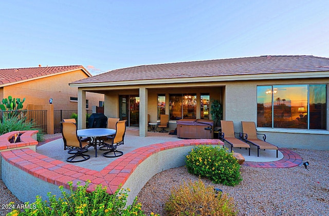 exterior space featuring a hot tub