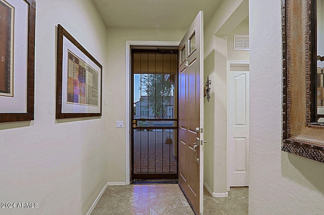 doorway featuring light tile patterned floors