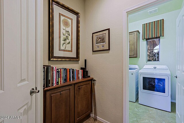 laundry area featuring washing machine and dryer