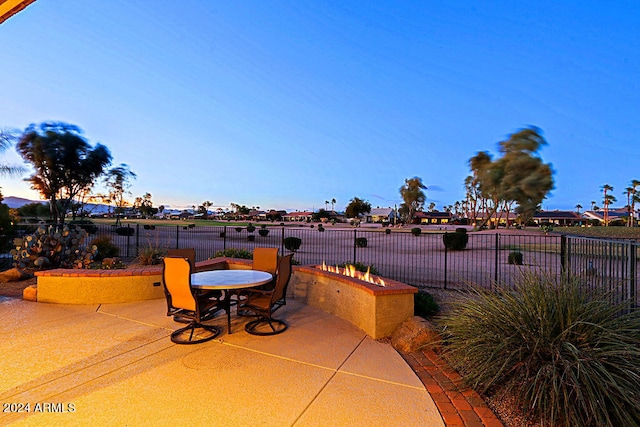 view of patio terrace at dusk