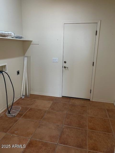 washroom with tile patterned floors, electric dryer hookup, baseboards, and laundry area