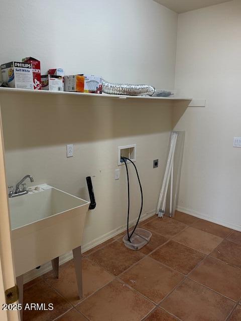 laundry area featuring washer hookup, a sink, baseboards, hookup for an electric dryer, and laundry area