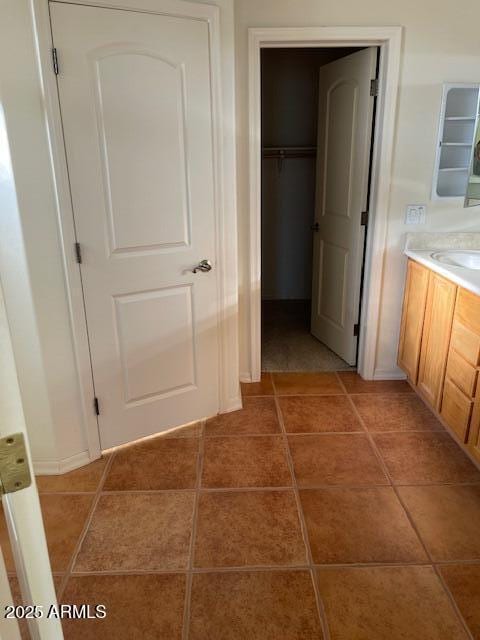 bathroom featuring tile patterned flooring and vanity