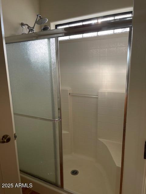 bathroom with a stall shower