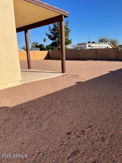 view of yard with a patio and fence