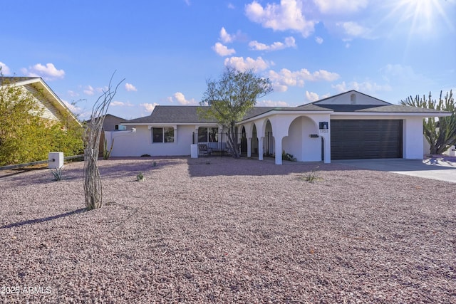 ranch-style home featuring a garage