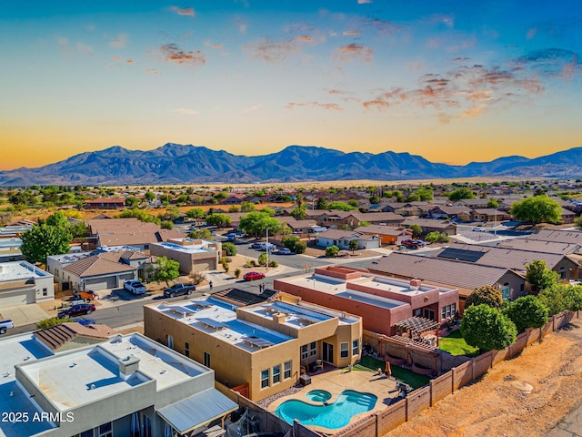 drone / aerial view featuring a residential view and a mountain view